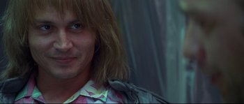 Movie still from “Blow” (2001), directed by Ted Demme – A person with long brown hair; Close Up shot, Low angle
