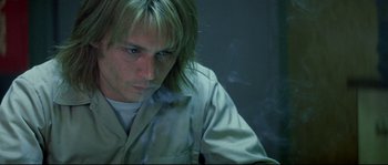 Movie still from “Blow” (2001), directed by Ted Demme – A person with long hair; Close Up shot, High angle