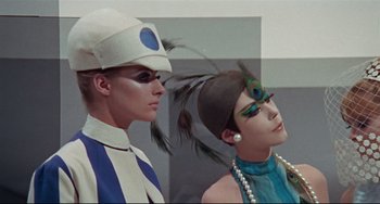 Movie still from “Blow-Up” (1966), directed by Michelangelo Antonioni – A man and a woman wearing costumes and makeup; Close Up shot, Low angle