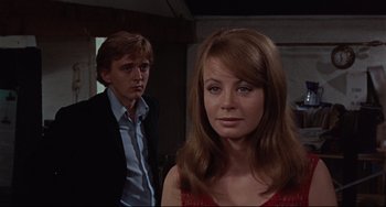 Movie still from “Blow-Up” (1966), directed by Michelangelo Antonioni – A man and a woman standing next to each other in a room; Close Up shot, Low angle