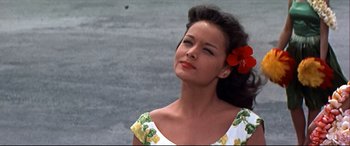 Movie still from “Blue Hawaii” (1961), directed by Norman Taurog – A beautiful woman with a flower in her hair; Close Up shot, Low angle
