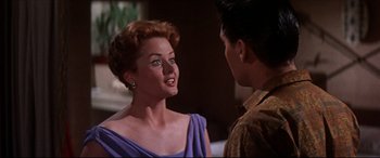 Movie still from “Blue Hawaii” (1961), directed by Norman Taurog – A man and a woman talking to each other; Close Up shot, Over the shoulder angle