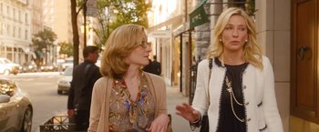 Movie still from “Blue Jasmine” (2013), directed by Woody Allen – Two women walking down the street talking to each other; Medium shot, Over the shoulder angle
