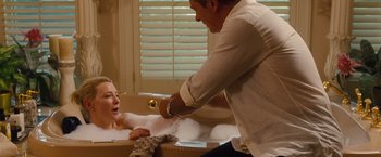 Movie still from “Blue Jasmine” (2013), directed by Woody Allen – A man and a woman in a bath tub in a room; Medium shot, Over the shoulder angle