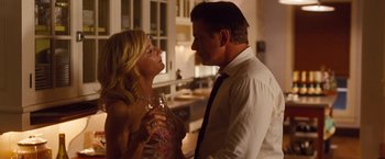 Movie still from “Blue Jasmine” (2013), directed by Woody Allen – A man and a woman holding wine glasses in a kitchen; Medium shot, Low angle