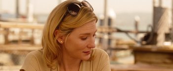 Movie still from “Blue Jasmine” (2013), directed by Woody Allen – A person wearing sunglasses; Close Up shot, Over the shoulder angle