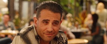 Movie still from “Blue Jasmine” (2013), directed by Woody Allen – A person wearing a shirt; Close Up shot, Over the shoulder angle