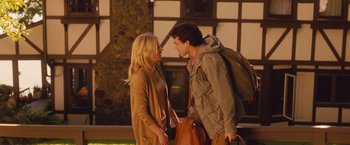 Movie still from “Blue Jasmine” (2013), directed by Woody Allen – A man and a woman standing next to each other; Medium shot, Over the shoulder angle