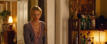 Movie still from “Blue Jasmine” (2013), directed by Woody Allen – A woman standing in front of a door; Medium shot, Over the shoulder angle