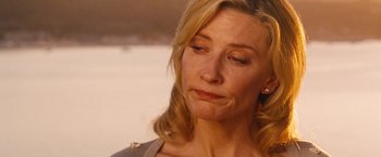 Movie still from “Blue Jasmine” (2013), directed by Woody Allen – A person looking down at her face; Close Up shot, Over the shoulder angle