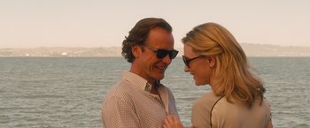 Movie still from “Blue Jasmine” (2013), directed by Woody Allen – A man and a woman standing next to a body of water; Close Up shot, Over the shoulder angle