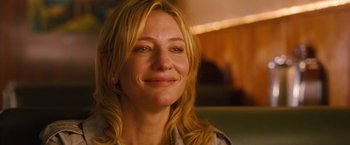 Movie still from “Blue Jasmine” (2013), directed by Woody Allen – A person with long blonde hair; Close Up shot, Over the shoulder angle