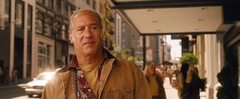 Movie still from “Blue Jasmine” (2013), directed by Woody Allen – A person wearing a jacket; Close Up shot, Over the shoulder angle