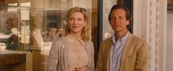 Movie still from “Blue Jasmine” (2013), directed by Woody Allen – A woman and a man standing next to each other in front of a window; Close Up shot, Over the shoulder angle