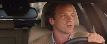 Movie still from “Blue Jasmine” (2013), directed by Woody Allen – A person in a car; Close Up shot, Over the shoulder angle