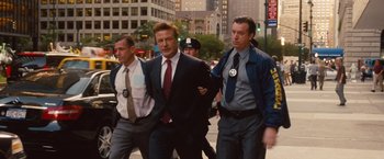 Movie still from “Blue Jasmine” (2013), directed by Woody Allen – A group of men walking down a street; Medium shot, Low angle