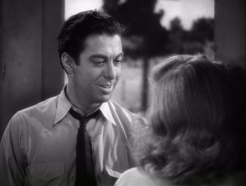 Movie still from “Blues in the Night” (1941), directed by Anatole Litvak – A black and white photo of a man and a woman talking; Close Up shot, Over the shoulder angle