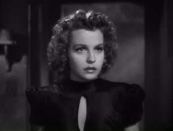 Movie still from “Blues in the Night” (1941), directed by Anatole Litvak – A black and white photo of a woman with curly hair; Close Up shot, Low angle