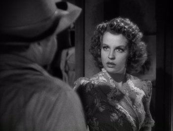 Movie still from “Blues in the Night” (1941), directed by Anatole Litvak – An old black and white photo of a woman looking at a man; Close Up shot, Over the shoulder angle