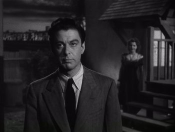 Movie still from “Blues in the Night” (1941), directed by Anatole Litvak – A black and white photo of a man and a woman; Medium shot, Low angle