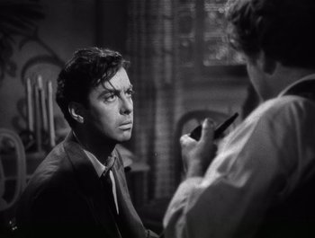 Movie still from “Blues in the Night” (1941), directed by Anatole Litvak – An old photo of a man and a woman looking at each other; Close Up shot, Over the shoulder angle