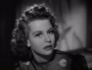 Movie still from “Blues in the Night” (1941), directed by Anatole Litvak – A black - and - white photo of a woman in a dress; Close Up shot, High angle