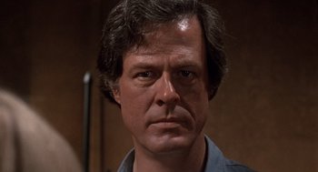 Movie still from “Bob & Carol & Ted & Alice” (1969), directed by Paul Mazursky – A man's face in front of a mirror; Close Up shot, Over the shoulder angle