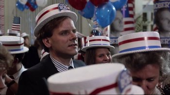 Movie still from “Bob Roberts” (1992), directed by Tim Robbins – A group of people wearing patriotic hats and smiling; Close Up shot, Low angle