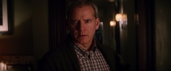 Movie still from “The Amazing Spider-Man 2” (2014), directed by Marc Webb – A person wearing a plaid shirt; Close Up shot, Over the shoulder angle