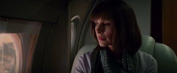 Movie still from “The Amazing Spider-Man 2” (2014), directed by Marc Webb – A woman sitting on a plane looking out the window; Close Up shot, Low angle