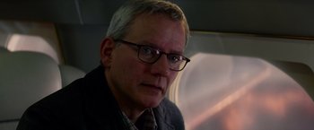 Movie still from “The Amazing Spider-Man 2” (2014), directed by Marc Webb – A person wearing glasses and a jacket; Close Up shot, Over the shoulder angle