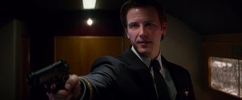 Movie still from “The Amazing Spider-Man 2” (2014), directed by Marc Webb – A man in a suit and tie pointing at the camera; Close Up shot, Low angle