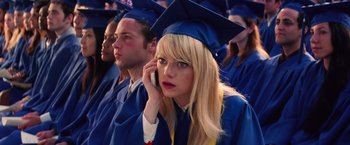 Movie still from “The Amazing Spider-Man 2” (2014), directed by Marc Webb – A woman in a cap and gown talking on a cell phone; Close Up shot, Overhead angle