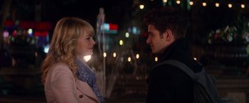 Movie still from “The Amazing Spider-Man 2” (2014), directed by Marc Webb – A man and a woman standing next to each other on the street; Medium shot, Over the shoulder angle