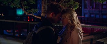 Movie still from “The Amazing Spider-Man 2” (2014), directed by Marc Webb – A man and a woman standing next to each other in front of a tree at night; Close Up shot, Over the shoulder angle