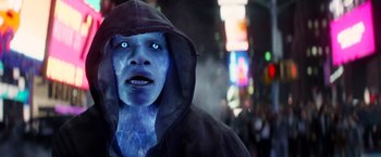 Movie still from “The Amazing Spider-Man 2” (2014), directed by Marc Webb – A man with blue eyes wearing a hooded jacket; Close Up shot, Over the shoulder angle