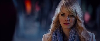 Movie still from “The Amazing Spider-Man 2” (2014), directed by Marc Webb – A person with long blonde hair; Close Up shot, Over the shoulder angle