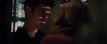 Movie still from “The Amazing Spider-Man 2” (2014), directed by Marc Webb – A man and a woman looking at one another in the dark; Close Up shot, Over the shoulder angle