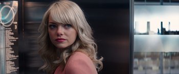 Movie still from “The Amazing Spider-Man 2” (2014), directed by Marc Webb – A woman with blonde hair and blue eyes; Close Up shot, Over the shoulder angle