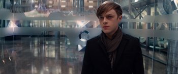 Movie still from “The Amazing Spider-Man 2” (2014), directed by Marc Webb – A young man in a black jacket and a scarf; Close Up shot, Over the shoulder angle