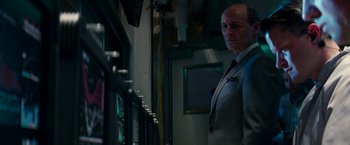 Movie still from “The Amazing Spider-Man 2” (2014), directed by Marc Webb – A man in a suit standing in front of a window; Close Up shot, Low angle