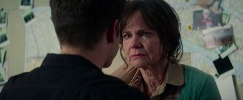 Movie still from “The Amazing Spider-Man 2” (2014), directed by Marc Webb – An older woman looking at a younger man; Close Up shot, Over the shoulder angle