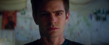 Movie still from “The Amazing Spider-Man 2” (2014), directed by Marc Webb – A man's face in a dark room; Close Up shot, Low angle