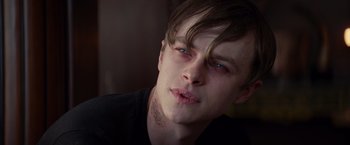 Movie still from “The Amazing Spider-Man 2” (2014), directed by Marc Webb – A young man with blue eyes is looking at the camera; Close Up shot, Over the shoulder angle