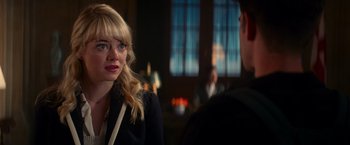Movie still from “The Amazing Spider-Man 2” (2014), directed by Marc Webb – A woman sitting next to a man in a room; Close Up shot, Over the shoulder angle