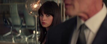 Movie still from “The Amazing Spider-Man 2” (2014), directed by Marc Webb – A person wearing a suit and tie; Close Up shot, Over the shoulder angle