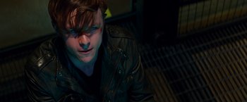 Movie still from “The Amazing Spider-Man 2” (2014), directed by Marc Webb – A man in a leather jacket sitting on the ground; Close Up shot, High angle