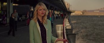 Movie still from “The Amazing Spider-Man 2” (2014), directed by Marc Webb – A woman standing on the side of a road; Medium shot, Over the shoulder angle
