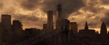 Movie still from “The Amazing Spider-Man 2” (2014), directed by Marc Webb – A view of a bridge and a city skyline at sunset; Extreme Wide shot, Low angle