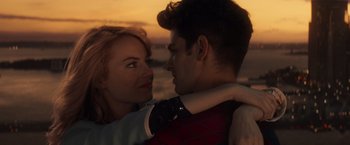 Movie still from “The Amazing Spider-Man 2” (2014), directed by Marc Webb – A man and a woman embracing each other in front of a sunset; Close Up shot, Over the shoulder angle